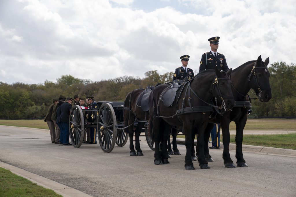 A horse-drawn funeral hearse is about to carry a fallen military soldier to his grave during Military Honor Guard Services at Fort Sam Houston
